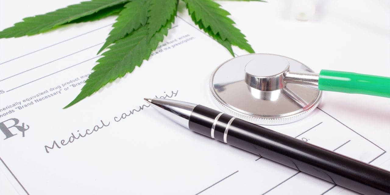 a prescription, pen and bell/diaphragm part of stethoscope and half part of cannabis plant